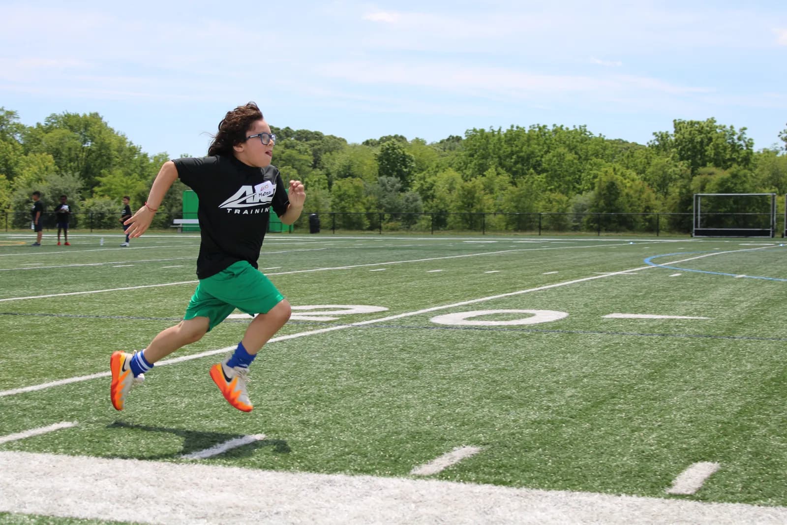 AIO Training athlete sprinting on the field