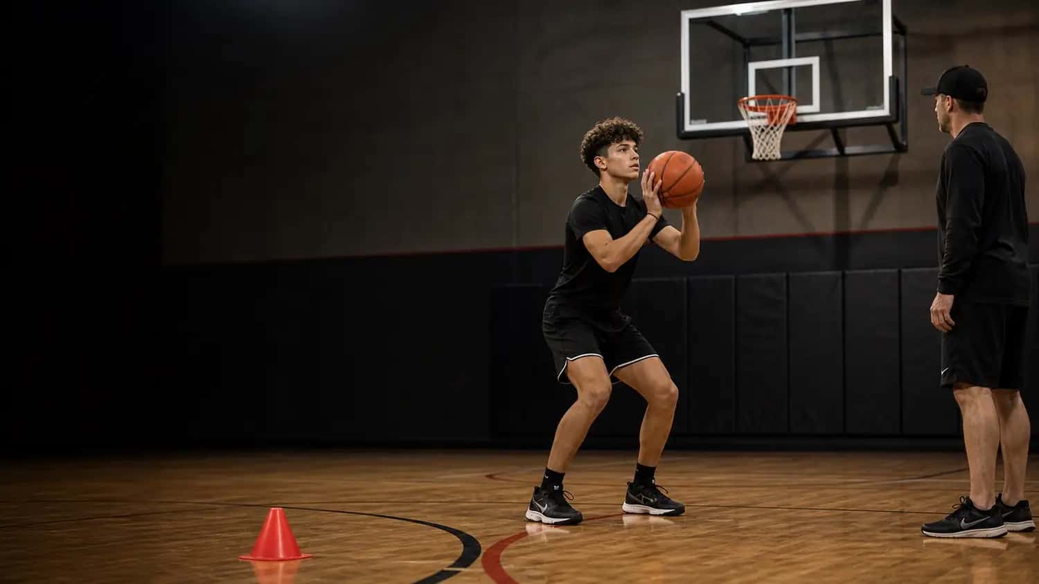 Youth basketball player shooting on an outdoor court